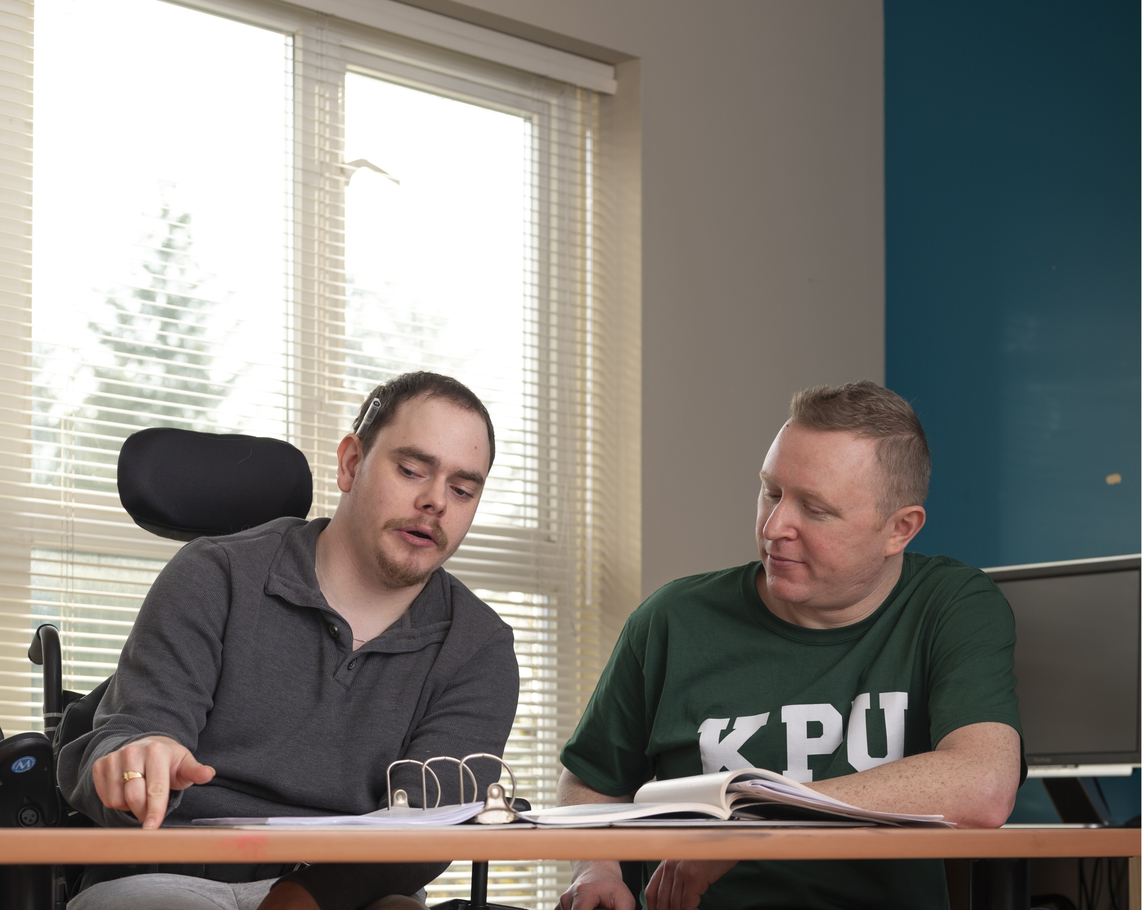 Instructor working with Phoenix Student